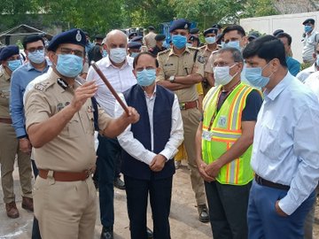 Dr. P K Mishra at the Ahmedabad plane crash site with relief officials
