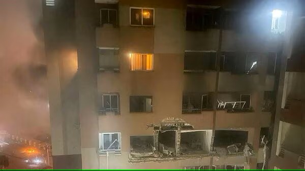 Firefighter in action after Iran strike, June 13"